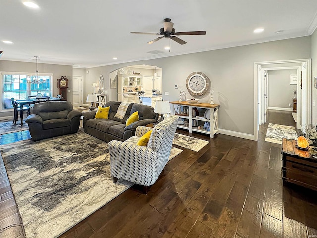 living room with baseboards, recessed lighting, arched walkways, wood-type flooring, and crown molding