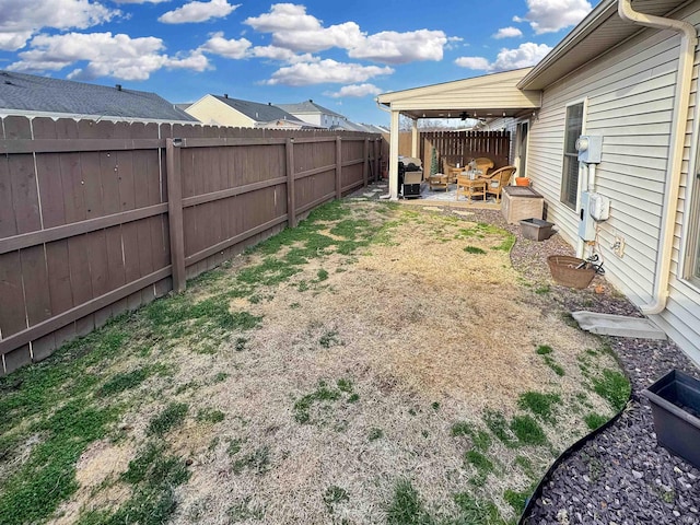 view of yard with a patio area and a fenced backyard