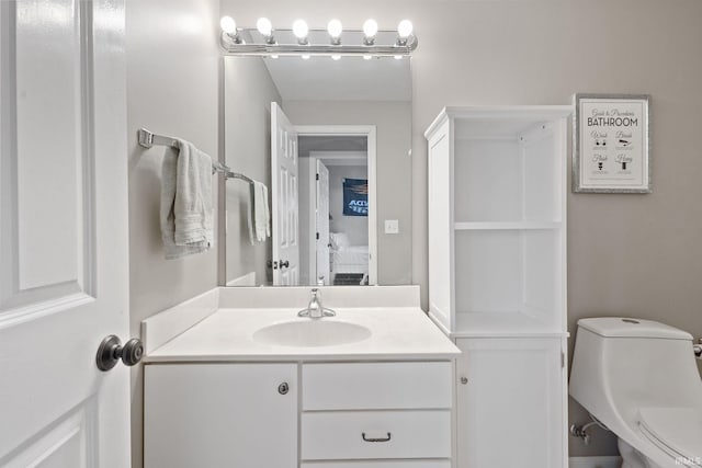 bathroom featuring vanity and toilet