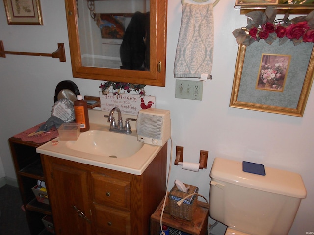 bathroom with toilet and vanity