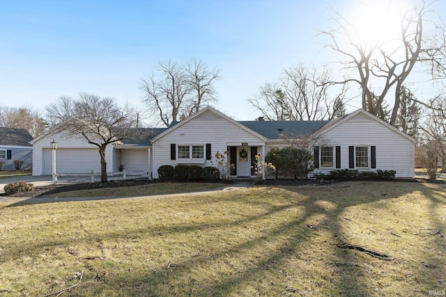 ranch-style house with an attached garage, driveway, and a front lawn