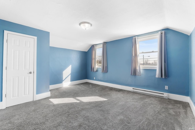 bonus room featuring carpet floors, baseboard heating, a healthy amount of sunlight, and vaulted ceiling