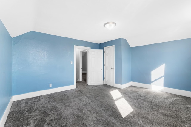 bonus room featuring lofted ceiling, baseboards, and carpet floors