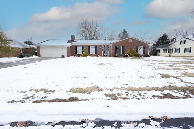 ranch-style home featuring brick siding and a garage