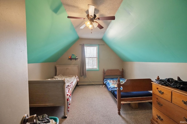 carpeted bedroom with a baseboard heating unit, a ceiling fan, and vaulted ceiling