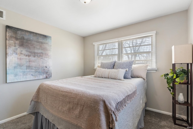 bedroom featuring visible vents, baseboards, and dark colored carpet