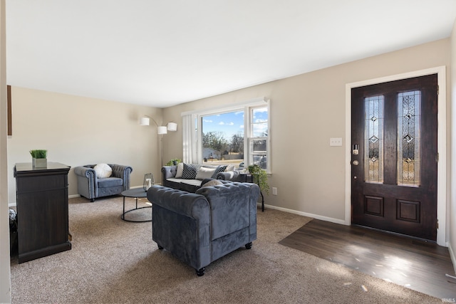 living room with baseboards and carpet