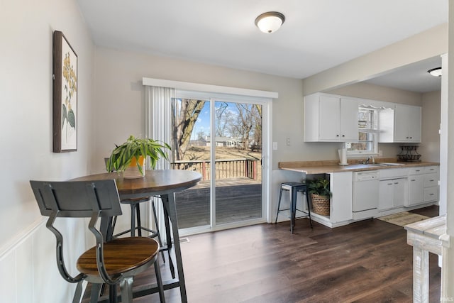 dining area featuring dark wood finished floors