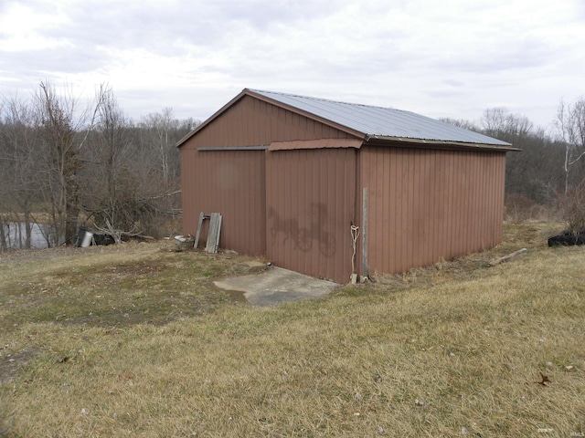 view of pole building with a lawn