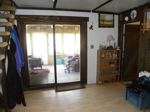 doorway to outside featuring wood finished floors