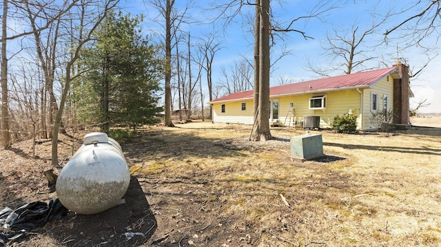 view of yard featuring central air condition unit