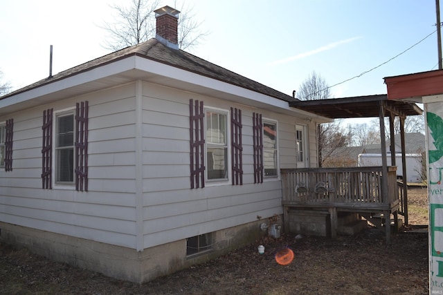 view of property exterior with a deck