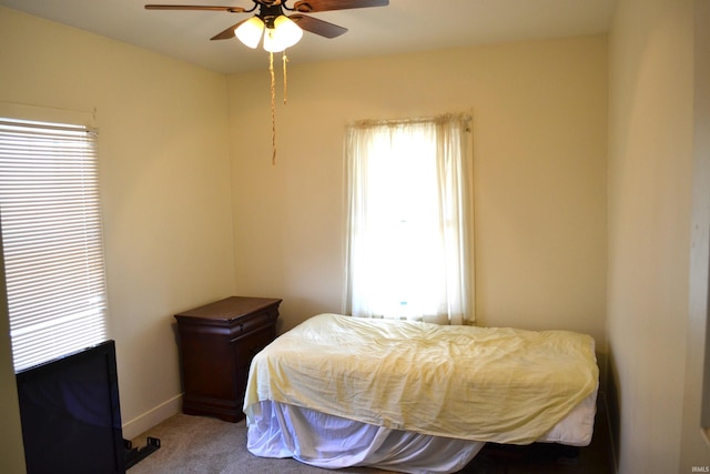 bedroom featuring baseboards, carpet, and a ceiling fan