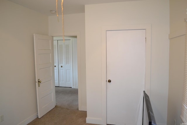 unfurnished bedroom featuring baseboards and carpet floors