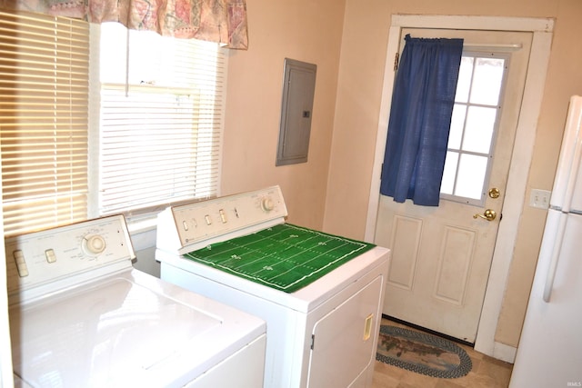 laundry area with electric panel, laundry area, and separate washer and dryer