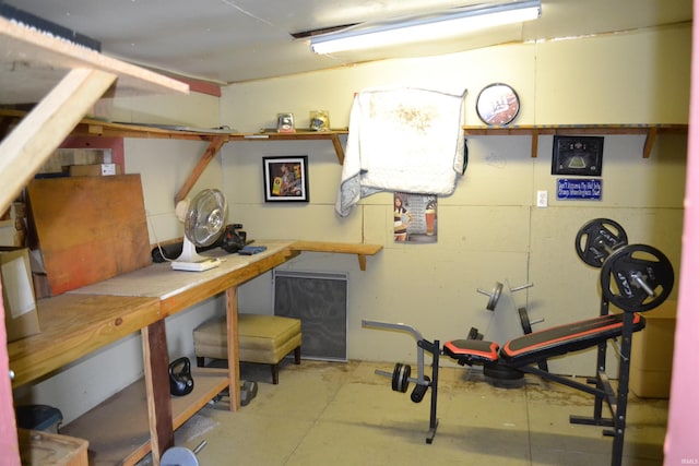 finished basement featuring a workshop area