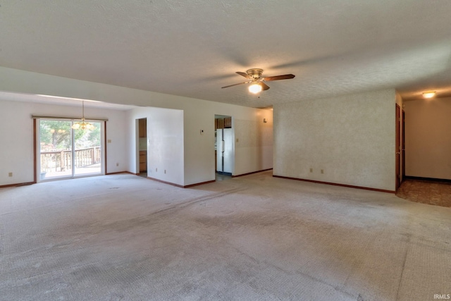 unfurnished room featuring a textured ceiling, baseboards, light colored carpet, and ceiling fan with notable chandelier