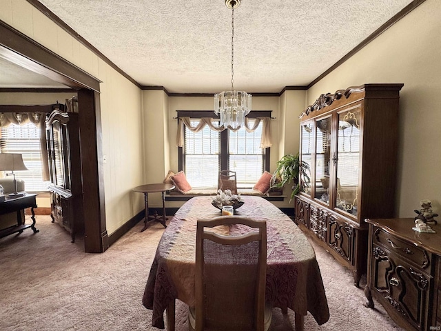 dining space featuring a healthy amount of sunlight, a notable chandelier, light colored carpet, and ornamental molding