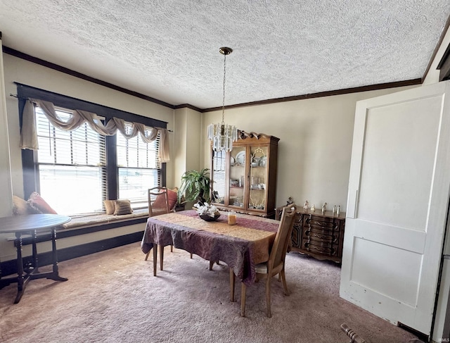 dining room featuring a chandelier, a textured ceiling, crown molding, and carpet floors