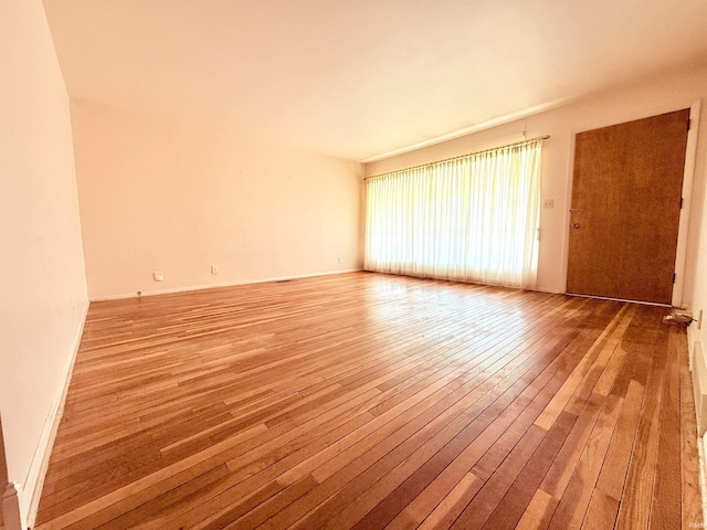 spare room with light wood-style floors