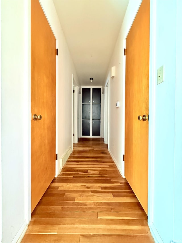 hall with light wood-style flooring