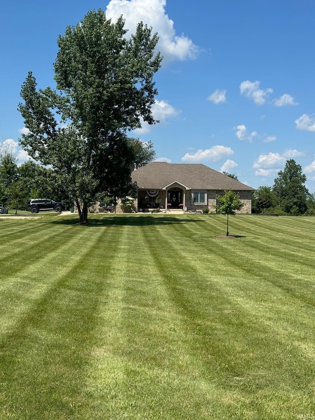 view of front of home with a front lawn