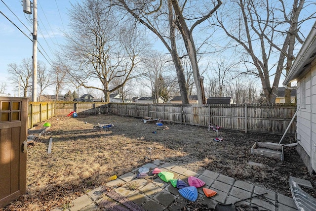 view of yard with a fenced backyard