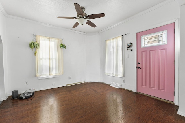 entrance foyer featuring visible vents, ornamental molding, and hardwood / wood-style flooring