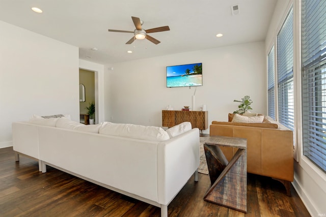 living room featuring visible vents, recessed lighting, baseboards, ceiling fan, and dark wood-style flooring