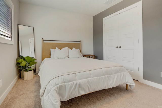 carpeted bedroom with baseboards