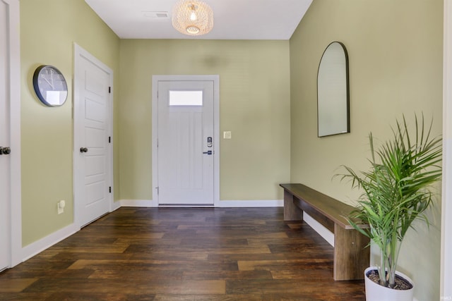 entrance foyer with baseboards and wood finished floors