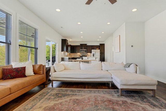 living area with recessed lighting, a ceiling fan, and dark wood-style flooring