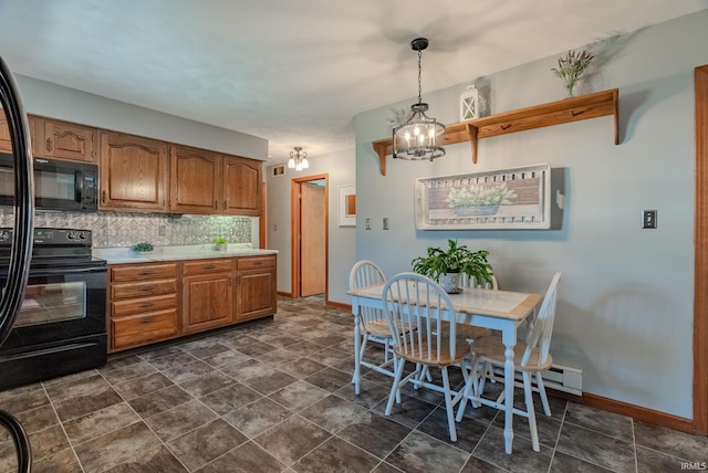 kitchen with brown cabinets, black appliances, light countertops, pendant lighting, and tasteful backsplash