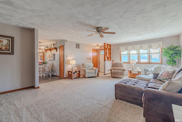 unfurnished living room featuring visible vents, baseboards, ceiling fan, carpet, and a textured ceiling