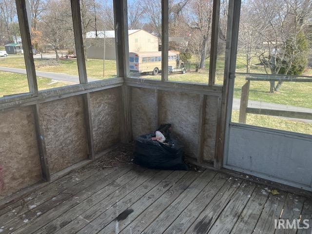 unfurnished sunroom with a wealth of natural light