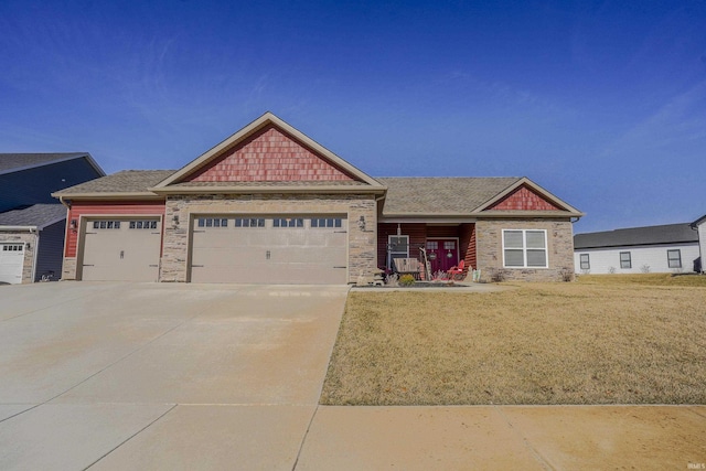 craftsman house featuring stone siding, a front lawn, concrete driveway, and a garage