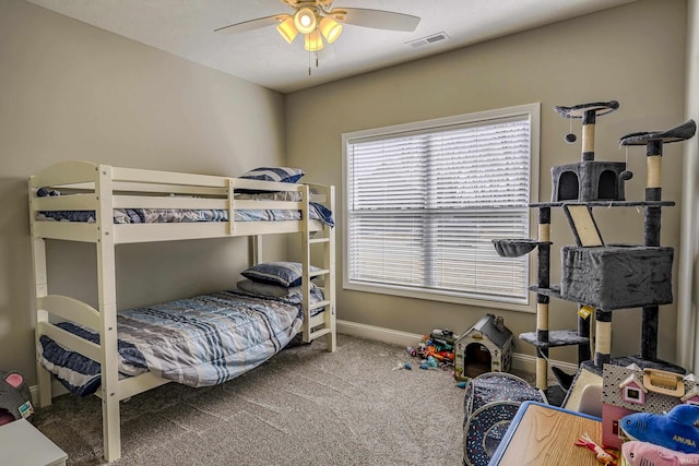 bedroom with visible vents, carpet flooring, baseboards, and ceiling fan