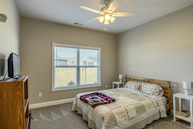 carpeted bedroom featuring visible vents, baseboards, and ceiling fan