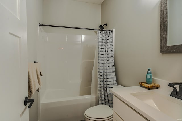 bathroom featuring vanity, shower / tub combo, and toilet