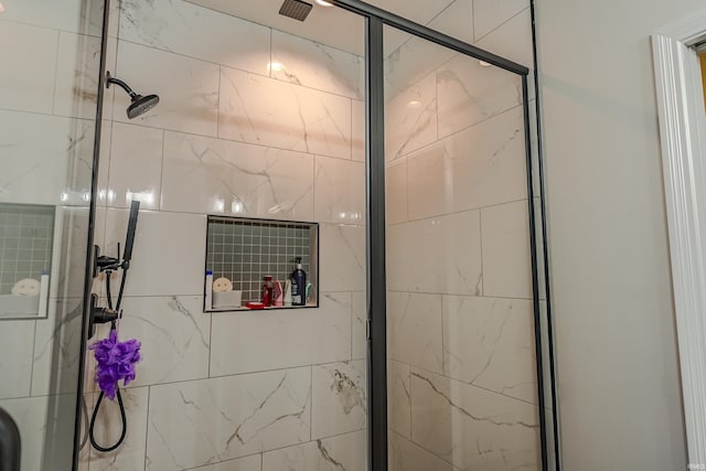 full bath featuring a shower stall