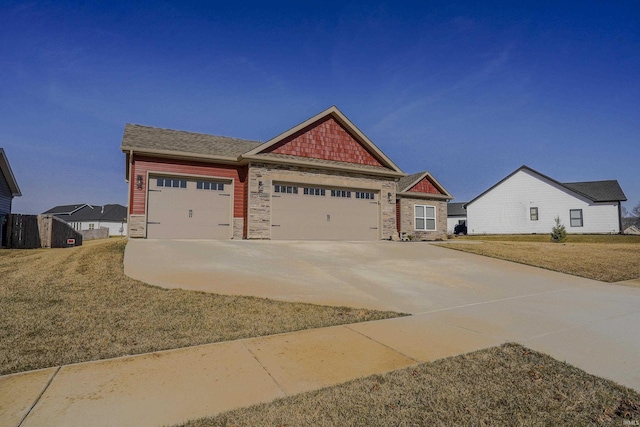 craftsman-style house with stone siding, driveway, and an attached garage