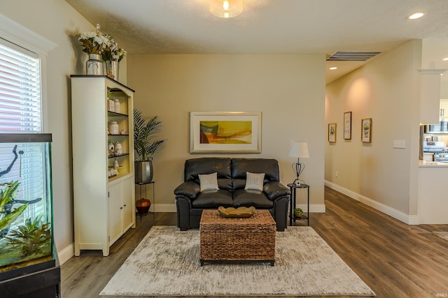 sitting room with visible vents, recessed lighting, baseboards, and wood finished floors