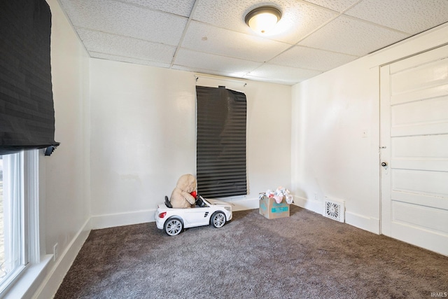 recreation room with visible vents, a paneled ceiling, carpet, and baseboards