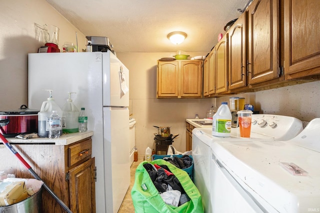 washroom with washing machine and clothes dryer