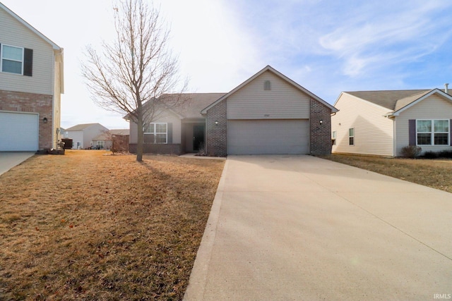 ranch-style house with a garage, brick siding, and driveway