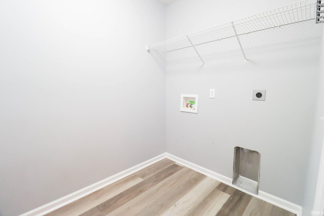 washroom with laundry area, hookup for an electric dryer, baseboards, and washer hookup