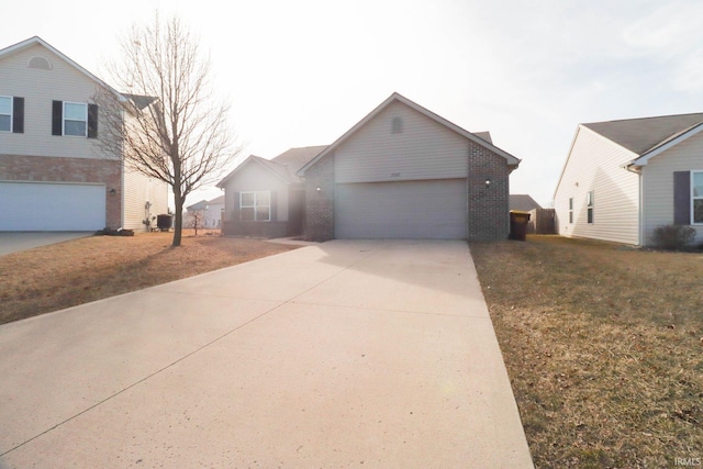 view of front facade with brick siding, concrete driveway, and an attached garage