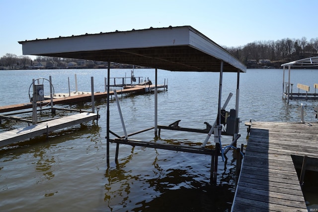 view of dock with a water view and boat lift