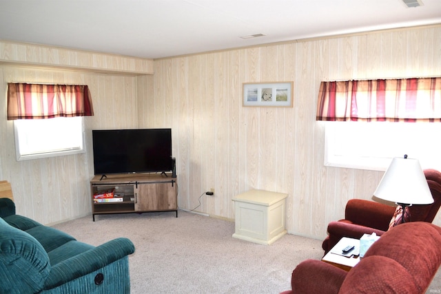 carpeted living area featuring visible vents