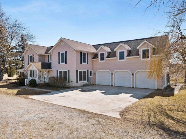 view of front of property featuring a garage and driveway